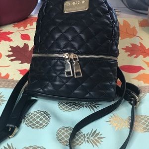 Small black leather BeBe backpack, In close to new condition! It may be new!
